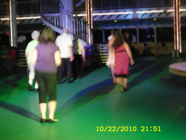 Karen Duquette line dancing on deck